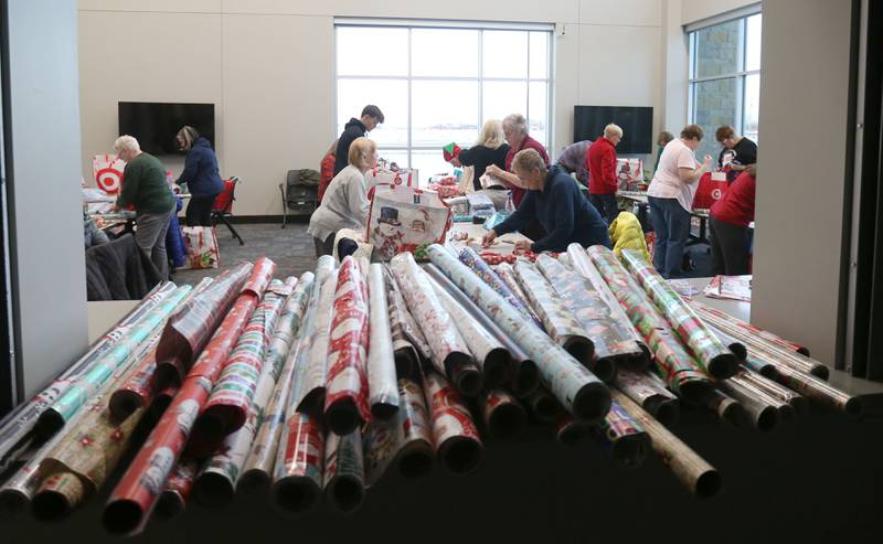 Over 50 volunteers wrapped presents for the Blue and Red Christmas for Kids on Tuesday, Dec. 16, 2025 at the City of Peru Public Safety Complex. Blue and Red will be delivering gifts to 85 children on Friday, Dec. 19. Area schools provided toys to fire and police departments with children's names and their Christmas lists. The program relays on donations including a $2,000 donation from the City of Peru in November. The Christmas program was established in 2013 by the Peru police and fire departments. It donates more than gifts to children in need; it provides personalized gifts for each child and family, including clothing and toys.