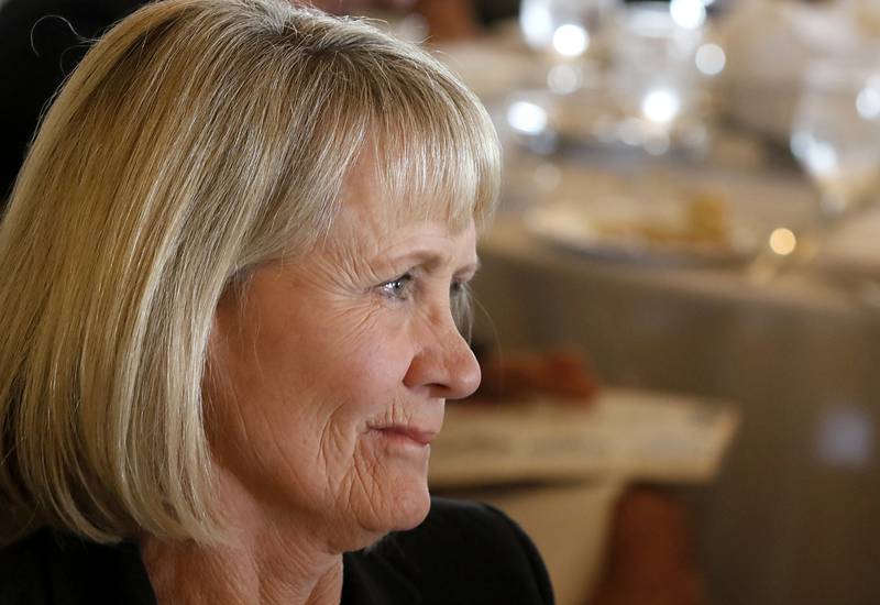 Debbie Gallagher listen as Kathleen Caldwell, of Caldwell Consulting Group, talks about her during the Northwest Herald's Women of Distinction award luncheon Wednesday June 7, 2023, at Boulder Ridge Country Club, in Lake in the Hills. The luncheon recognized 10 women in the community as Women of Distinction.