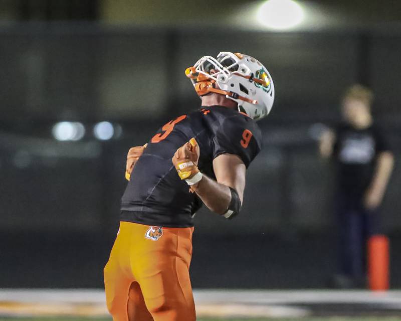 Plainfield East's Colin Dominiak (9) celebrates his sack of Yorkville's Jack Beetham (2) during football game between Yorkville at Plainfield East Friday, Sept 19, 2025 in Plainfield.
