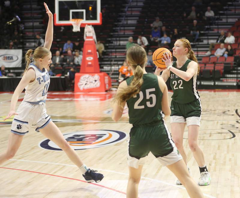 St. Edward's Elizabeth Leadley sinks a three point basket over Cissna Park's Sophie Duis during the Class 1A third place game on Friday, March 7, 2025 at CEFCU Arena in Normal.