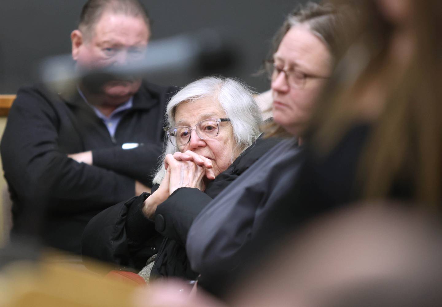 Tillie Mackey, a resident of the DeKalb County Rehabilitation and Nursing Center for four years, listens to speakers during public comment at the DeKalb County Board meeting Wednesday, April 20, 2022, in the legislative center in Sycamore. One of the items on the agenda was to vote on whether to sell the DeKalb County Rehabilitation and Nursing Center.