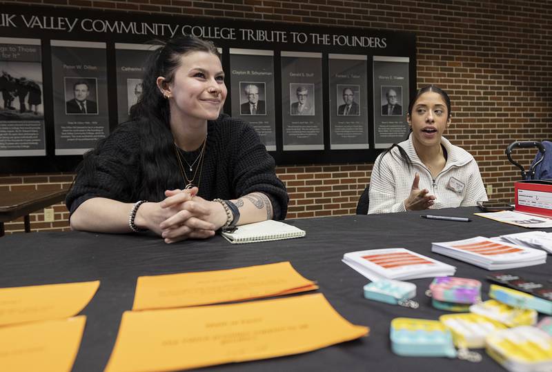 YWCA representatives Tessa Brubaker (left) and Natalee Boonen share the volunteer options people can sign up for at the advocacy center during a volunteer fair Thursday, April 2, 2026, at SVCC. The YWCA offers both crisis and non-crisis volunteer programs.