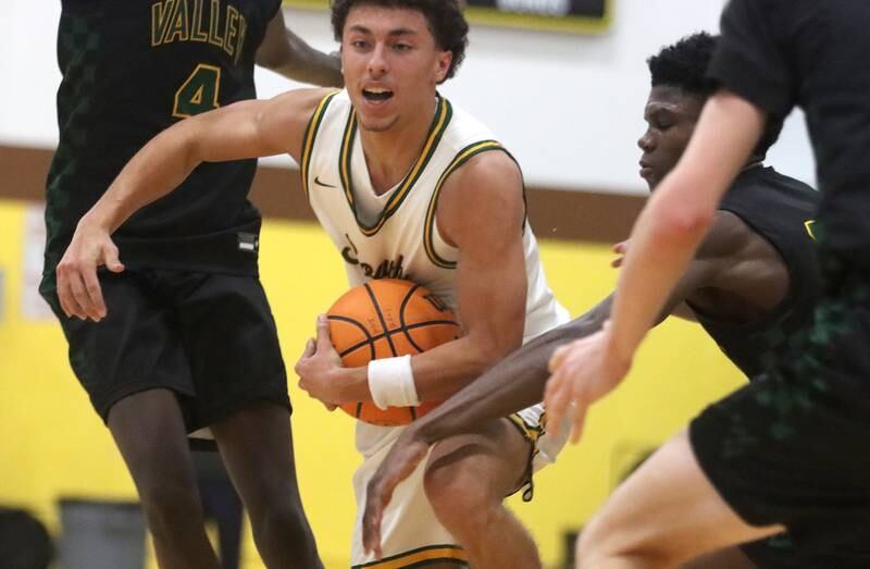 Crystal Lake South’s AJ Demirov navigates heavy traffic against Waubonsie Valley during Hinkle Holiday Classic varsity boys basketball tournament title game action on Friday, Dec. 27, 2024 at Jacobs High School in Algonquin.