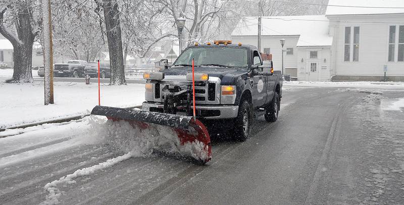 File photo: A village of Oswego snowplow clears Jay Street near the village's downtown following a snowstorm.