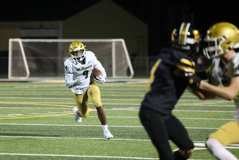 Bishop McNamara's Julius May runs the ball during the Fightin' Irish's 45-28 victory over Herscher on Friday, Sept. 5, 2025.