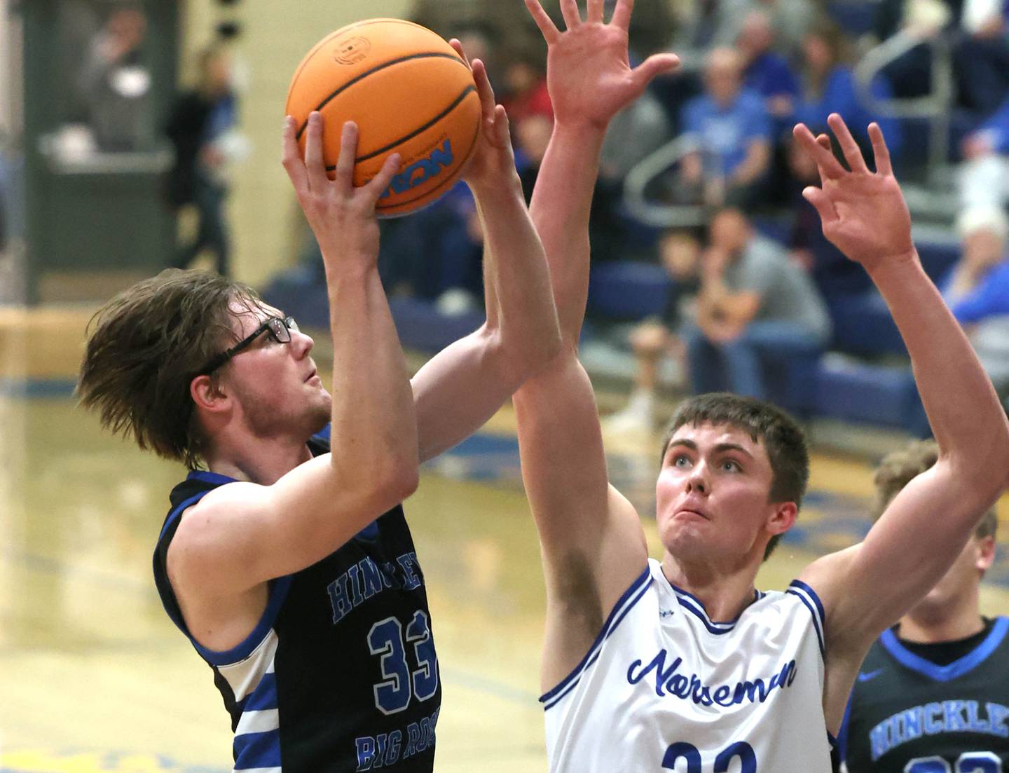 Hinckley-Big Rock's Marshall Ledbetter tries to shoot over Newark's Cody Kulbartz Friday, Feb. 6, 2026, during their Little 10 Conference third place game at Somonauk High School.