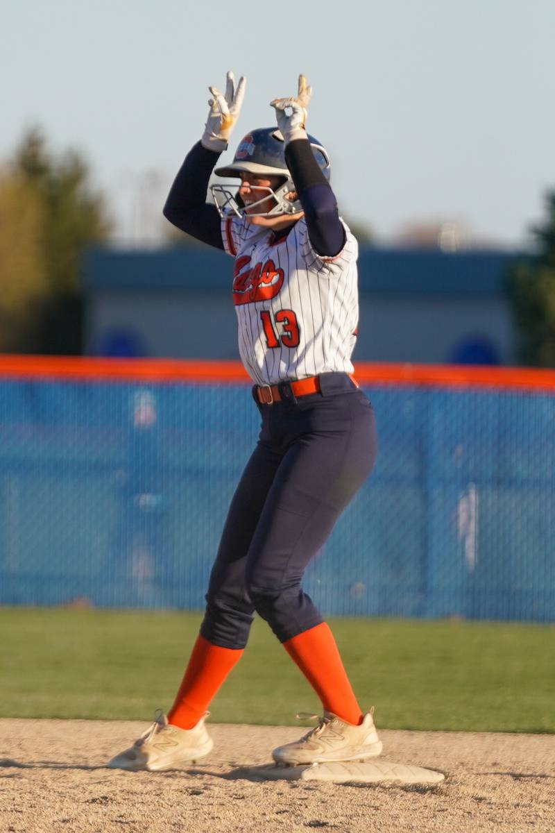 Oswego’s Ella Boling (13) celebrates after hitting driving in a run on a double against Downers Grove South during a softball game at Oswego High School on Tuesday, March 19, 2024.