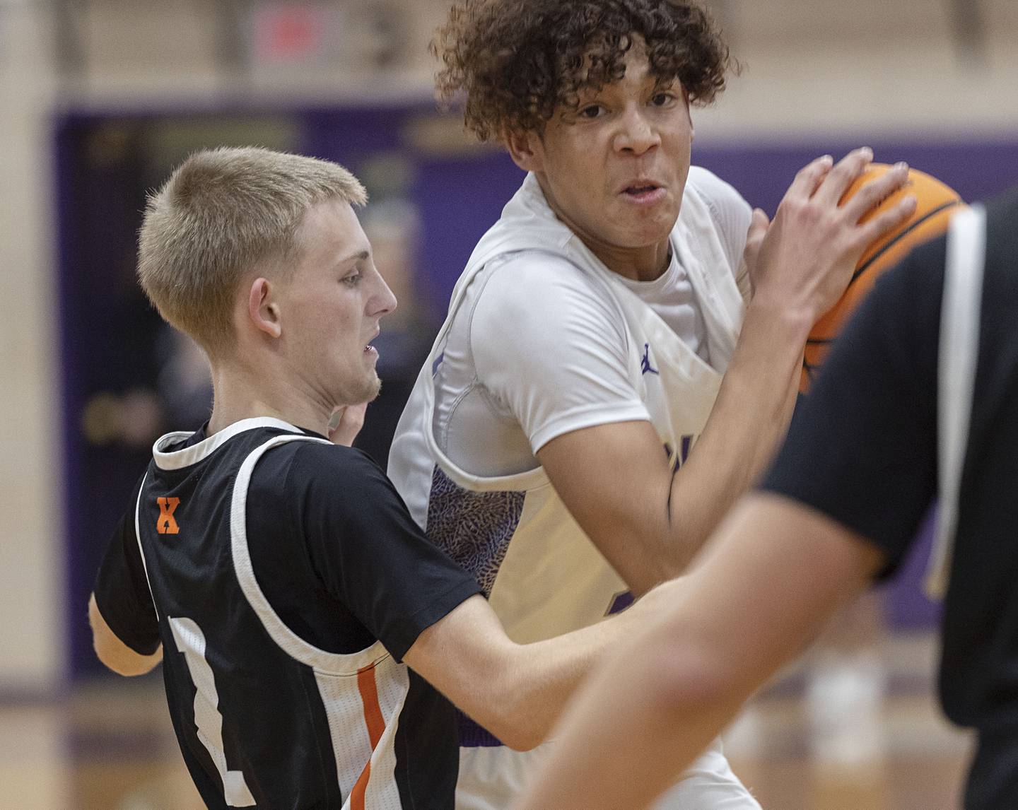Dixon’s Armahn McGowan works against Kewanee’s Isaiah Ince Tuesday, Dec. 2, 2025.