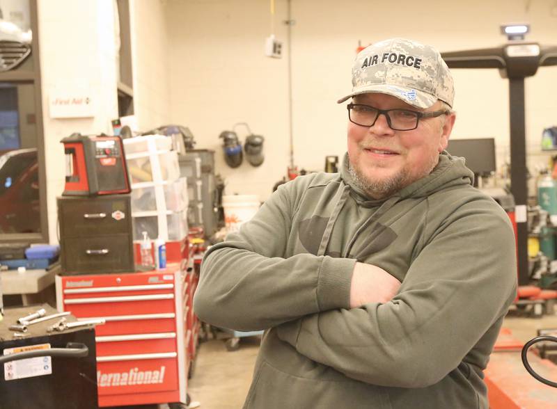 John Hladovack, auto mechanic instructor poses for a photo on Monday, May 1, 2023 at Ottawa High School.