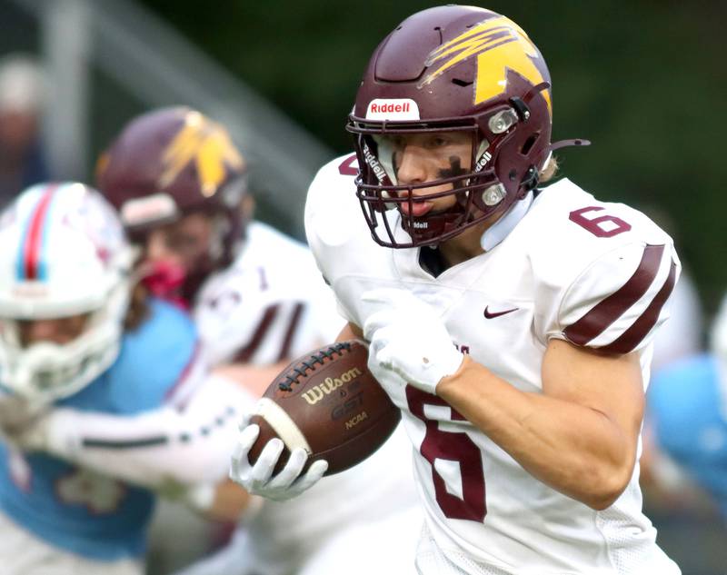 Richmond-Burton’s Hunter Carley sprints to a first-quarter touchdown in varsity football at George Harding Field on the campus of Marian Central High School in Woodstock on Friday, August 29, 2025.