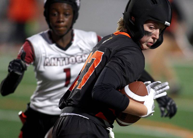 McHenry’s Chloe Casey heads for the end zone on a touchdown against Antioch in IHSA Regional Title Game action flag football at McHenry High School in McHenry on Thursday, Oct. 10, 2024.