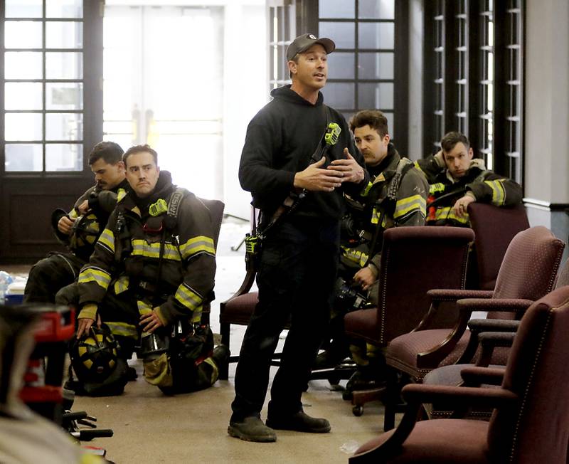 McHenry Fire Department instructor Kevin Sears  teaches firefighters on Tuesday April 15, 2025, during a RIT crew and chief divisional drill with other firefighters from area departments in a former bank building in Downtown McHenry.