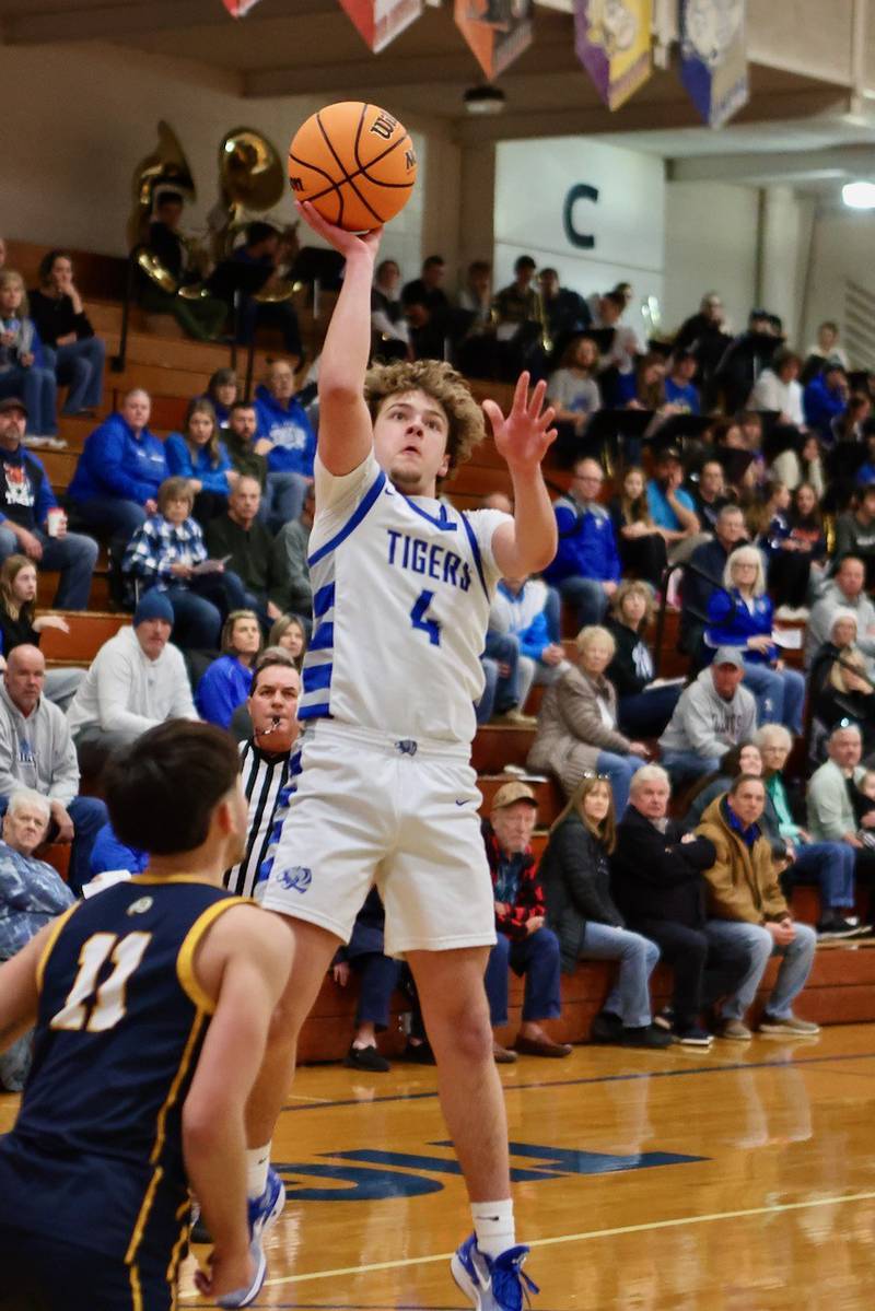 Princeton's Jayden Fulkerson shoots over Sterling's Nico Battaglion Friday night at Prouty Gym. The Tigers won 56-47.
