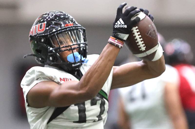 Northern Illinois receiver Eli Reed catches a pass during the teams first spring practice Wednesday, March 22, 2023, in the Chessick Practice Center at Northern Illinois University in DeKalb.