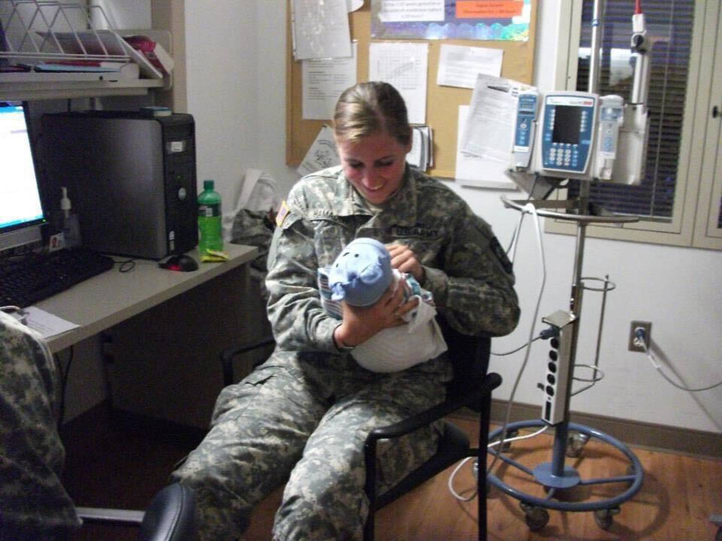 Randa Melms, clinical nurse at Northwestern Medicine Kishwaukee Hospital in DeKalb, poses in this undated photo with a baby during her time working a maternity unit with the U.S. Army Nursing Corps at Fort Bragg in North Carolina.