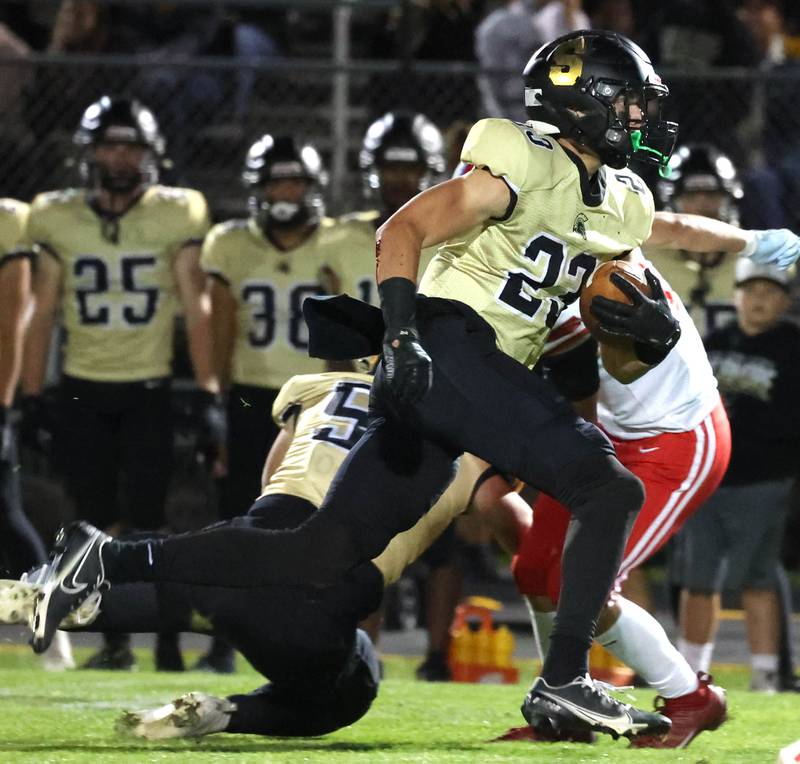 Sycamore's Dylan Hodges breaks through the Ottawa line for a big gain during their game Friday, Sept. 27, 2024, at Sycamore High School.