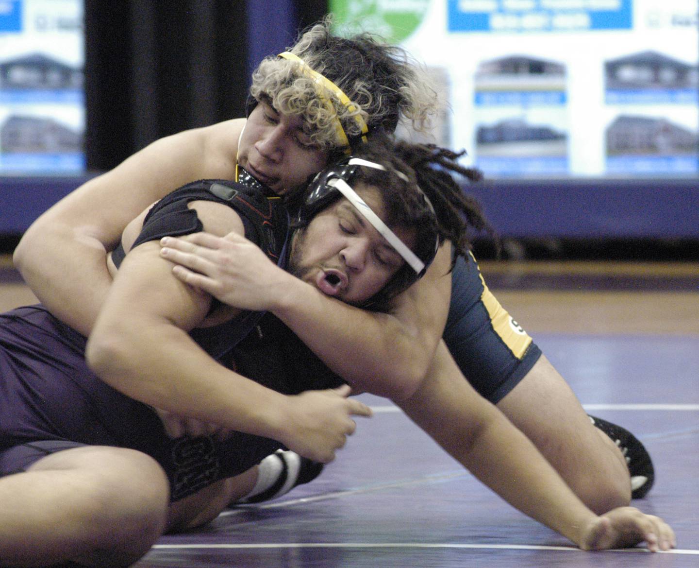 Sterling's Oswaldo Navarro and Dixon's Dylan Bopes grapple in the 285-pound third-place bout at the Class 2A Dixon Regional on Saturday, Feb. 8, 2025 at Lancaster Gym in Dixon.