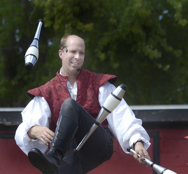 Gran Man The Entertainer shows his juggling skills on the stage Saturday during the annual Marseilles Renaissance Faire.
