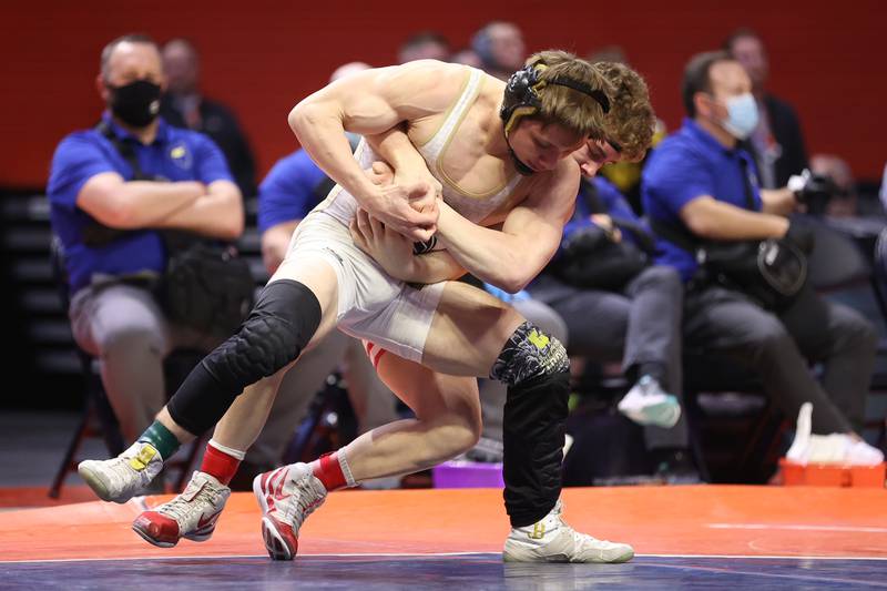 Sycamore’s Brayden Peet tries to escape Aura Christian’s Braden Stauffenbergin the Class 2A 152lb. championship match at State Farm Center in Champaign. Saturday, Feb. 19, 2022, in Champaign.