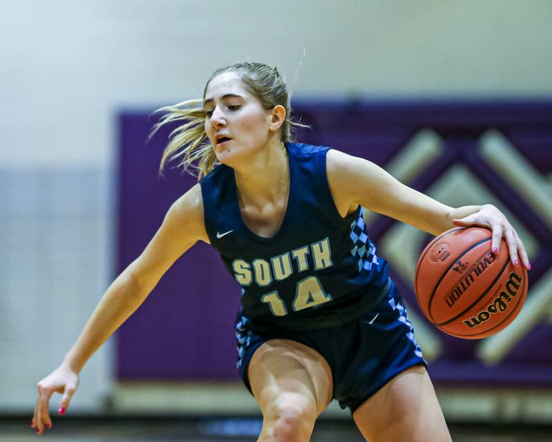 Downers Grove South's Allison Jarvis (14) handles the ball during girls basketball game between Downers Grove South at Downers Grove North. Dec 16, 2023.