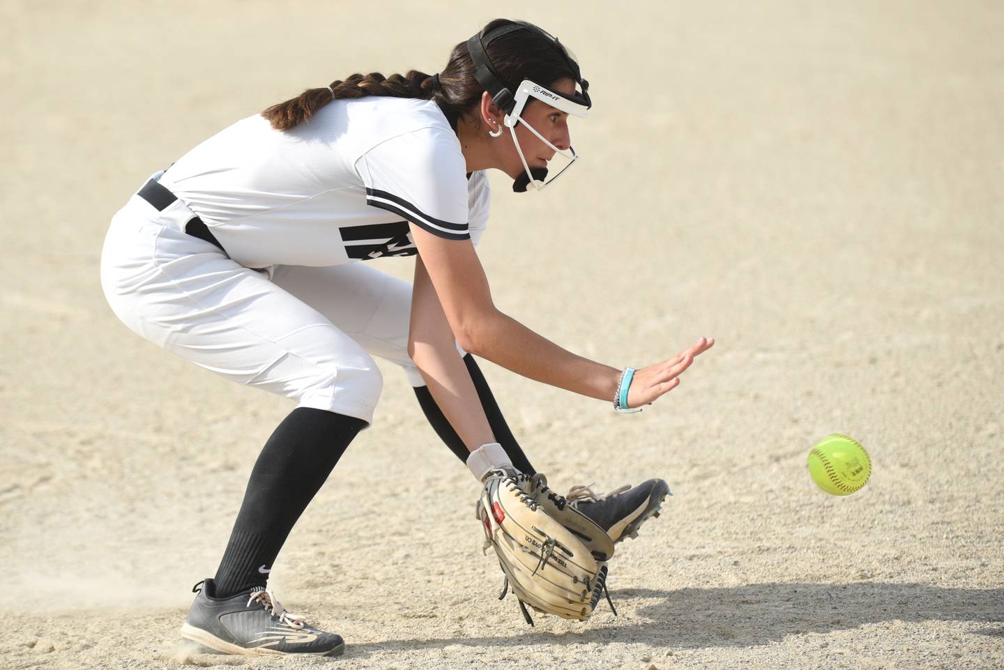 Bishop McNamara's Analeah Ramirez fields a ground ball during a home game against Kankakee Tuesday, May 13, 2025.
