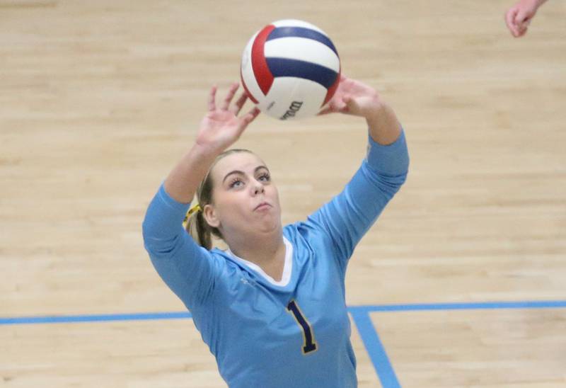 Marquette's Greysyn Carrier sets the ball in play against Serena on Wednesday, Oct. 22, 2025 in Bader Gymnasium at Marquette High School.