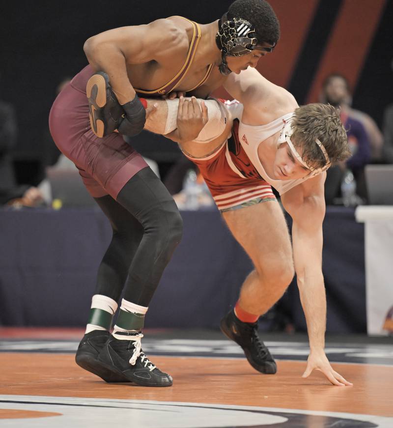 Lockport’s Justin Wardlow, left, battles Ethan Sonne of Mrist in the Class 3A 157-pound match at the boys IHSA wrestling finals at State Farm Center in Champaign on Saturday, Feb. 21, 2026.