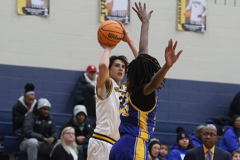 Joliet Catholic’s Elias Passel puts up the outside shot against Joliet Central on Tuesday, Jan 20, 2026 in Joliet.