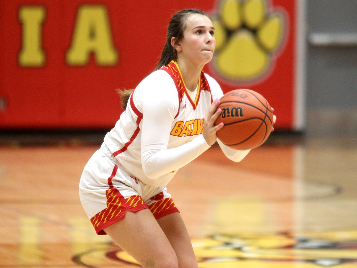 Batavia’s Brooke Carlson shoots three points during a game against St. Charles North at Batavia on Thursday, Jan. 12, 2023.