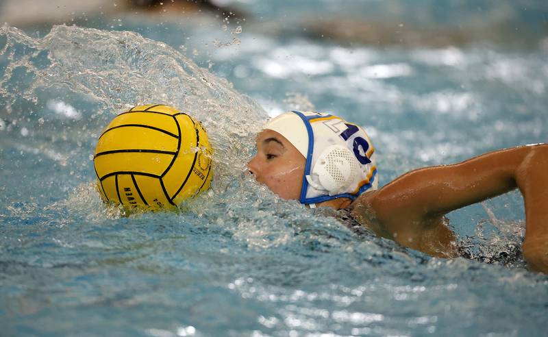 Lyons Township's Avery Watanabe (10) moves the ball forward during the IHSA State Finals of the Girls Water Polo Saturday, May 24, 2025 at Stevenson High School in Lincolnshire.