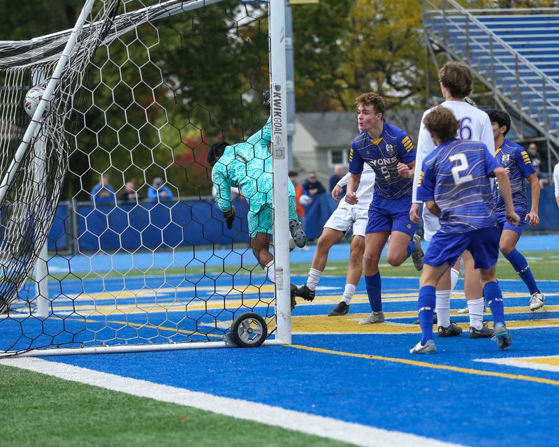 Lyons Owen Suda (9) heads in a goal late in their Class 3A Lyons Regional final soccer match.  Oct 21, 2023.