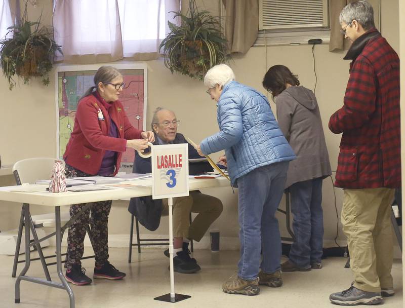 Voters wait to collect their ballots on Tuesday, April 1, 2025 at Christ Family Four Square Church in La Salle.