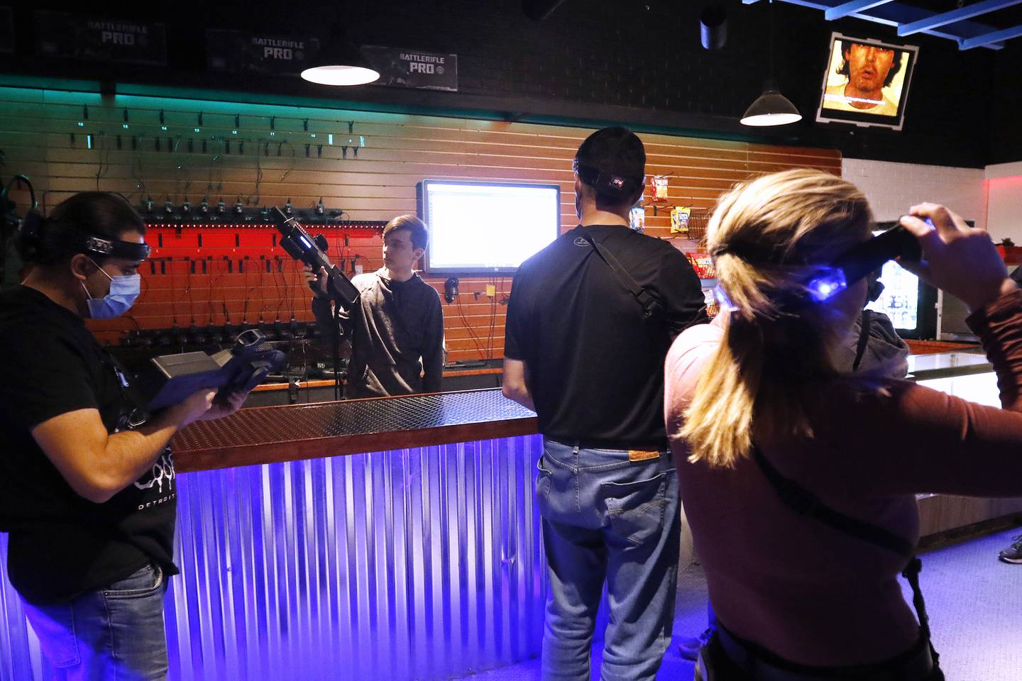 Associate Andrew Gordon goes over the rules with customers at Twisted Limits Laser Tag on Tuesday, Dec. 14, 2021, in  McHenry.  The business opened last December.