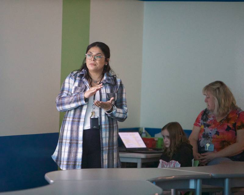 Araseli Rodriguez reads her book "Proudly Bilingual" on Thursday, April 27, 2023, at Riverwood Elementary School in McHenry.