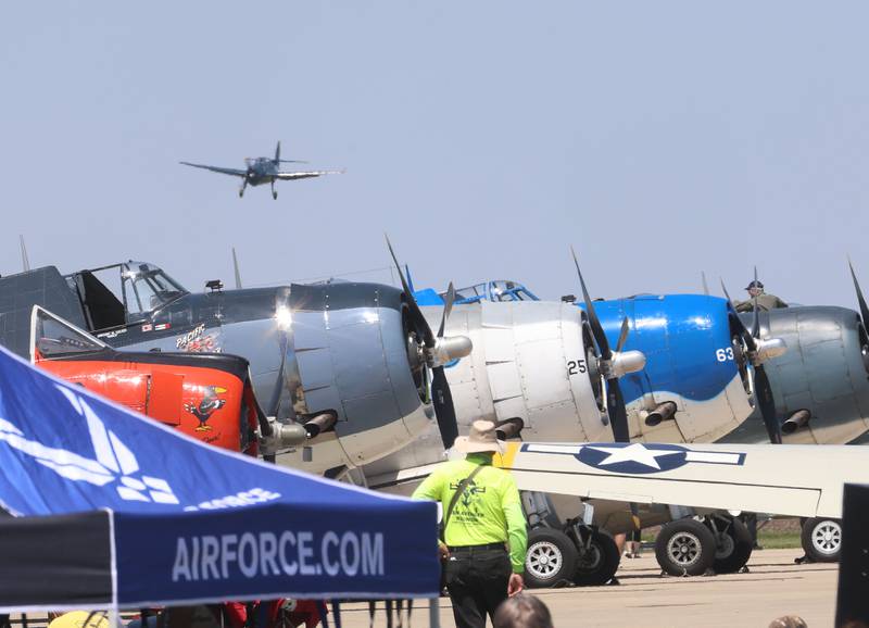 A TBM Avenger flies over other TBM's during the 11th annual TBM Reunion and Air Show on Friday, May 15, 2026 at the Illinois Valley Regional Airport in Peru.