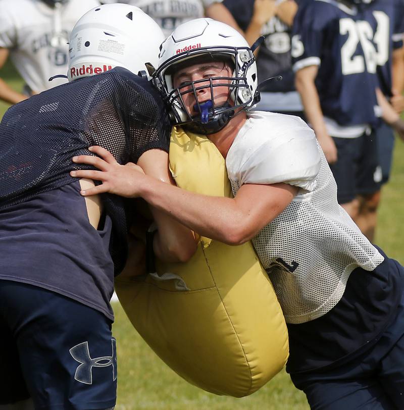 Cary-Grove’s Jack Rocen blocks during football practice Thursday, June 29, 2022, at Cary-Grove High School in Cary.
