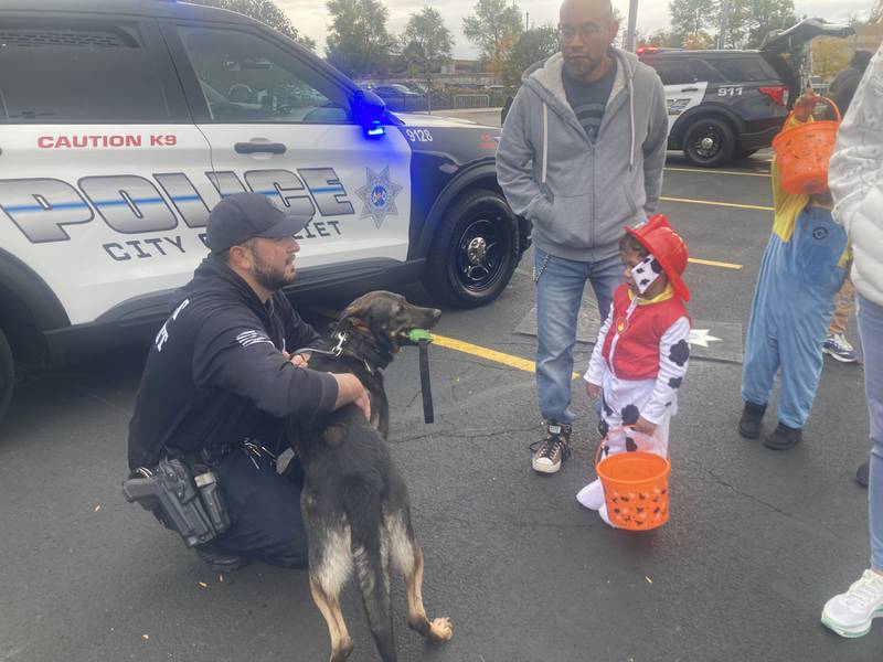 Joliet Police K9 Arrow greets fire dog impersonator Anthony, at the Joliet Police Trunk-or-Treat event. 
Saturday, Oct. 25, 2025.