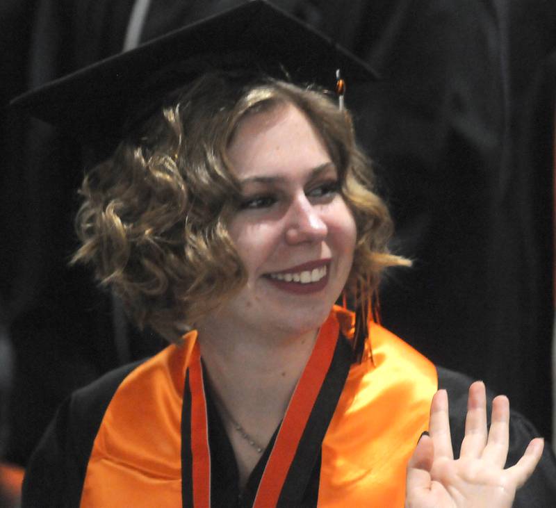 Ida Alt waves to the crowd Saturday, May 14, 2022, during the graduation ceremony at Crystal Lake Central High School.