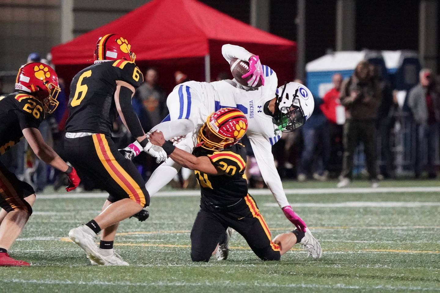 Batavia’s Chase Osborne (20) tackles Geneva’s Talyn Taylor (1) during a football game at Batavia High School on Friday, Oct. 4, 2024.