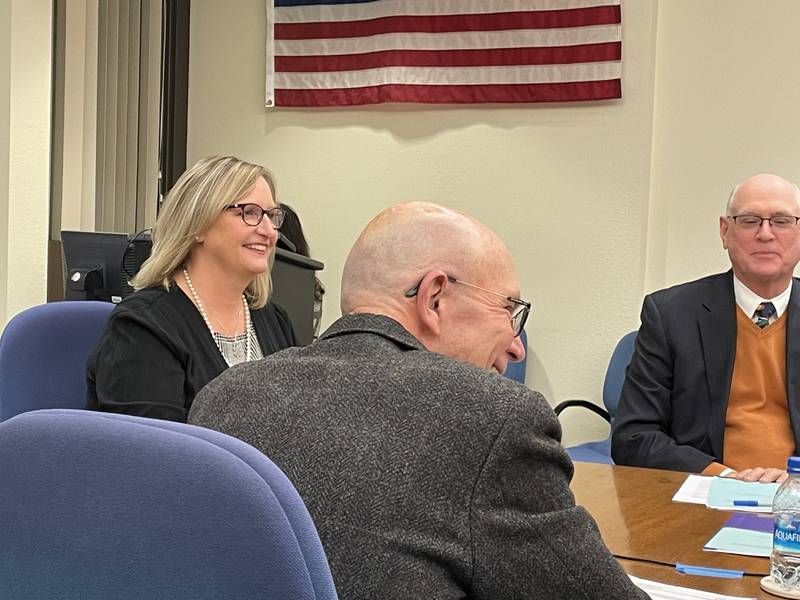 Tracy Morris with IVCC President Jerry Corcoran and board attorney Walt Zukowski during the Tuesday, Dec. 20, 2022, board meeting.