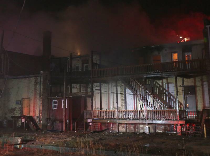 Flames emerge from the back of the structure at 708 Illinois Avenue on Friday, Dec. 30, 2022 downtown Mendota.