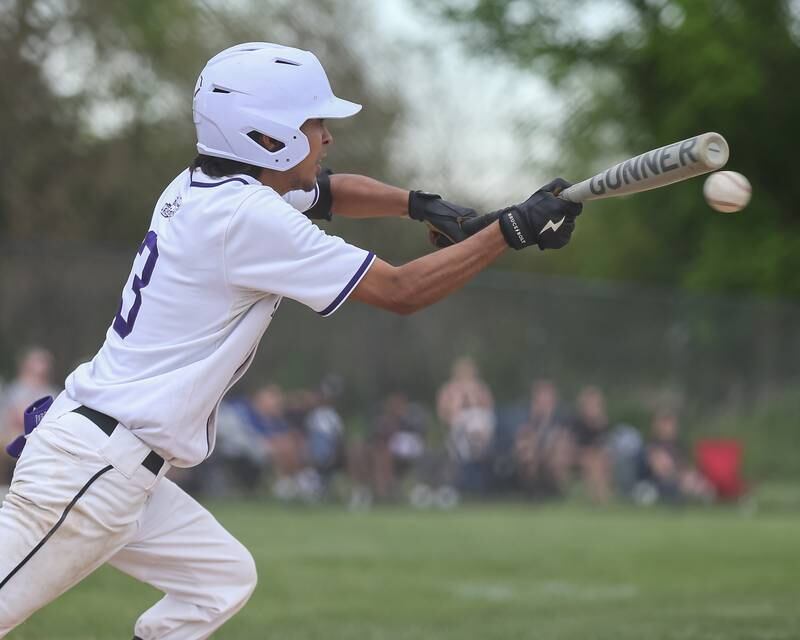 Plano's Jose Barraza (3) attempts a bunt during baseball game between Sandwich at Plano.  May 8, 2024