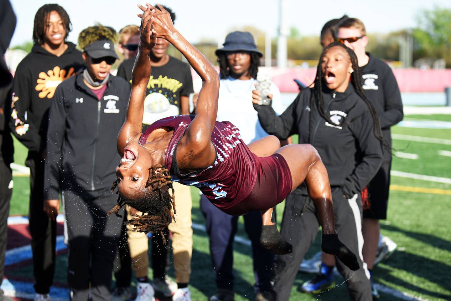 Nevaeh Lowe performs a celebratory backflip after helping the Kankakee girls track and field team to the IHSA Class 2A Kankakee Sectional championship in 2023.