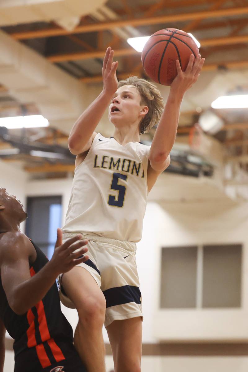 Lemont’s Rokas Castillo puts up a shot against Romeoville in the WJOL Thanksgiving Classic Championship in Joliet on Saturday.