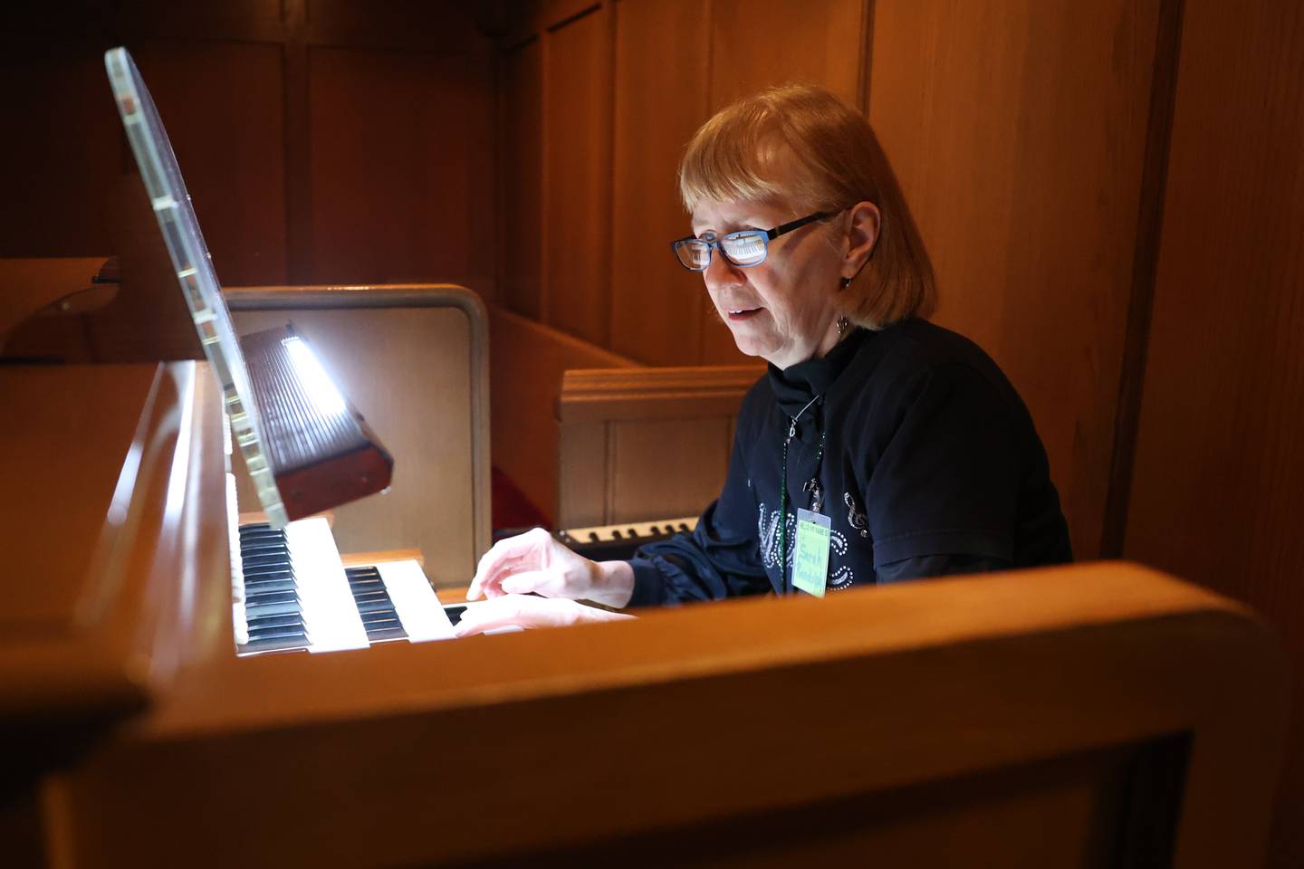 Sarah Randolph, a retired Lockport district music teacher, sits at an organ at the First Presbyterian Church in Joliet.