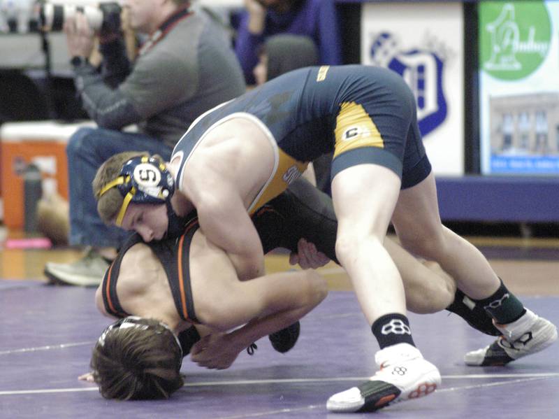 Sterling's Cael Lyons drives Freeport's Thomas Olson to the mat during their 126-pound third-place bout at the Class 2A Dixon Regional on Saturday, Feb. 8, 2025 at Lancaster Gym in Dixon.