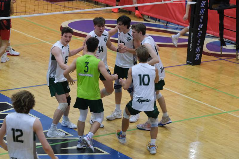 Glenbard West celebrates a 2 set win over Roncalli (IN) in the Lincoln-Way East Tournament title match. Saturday, April 30, 2022, in Frankfort.