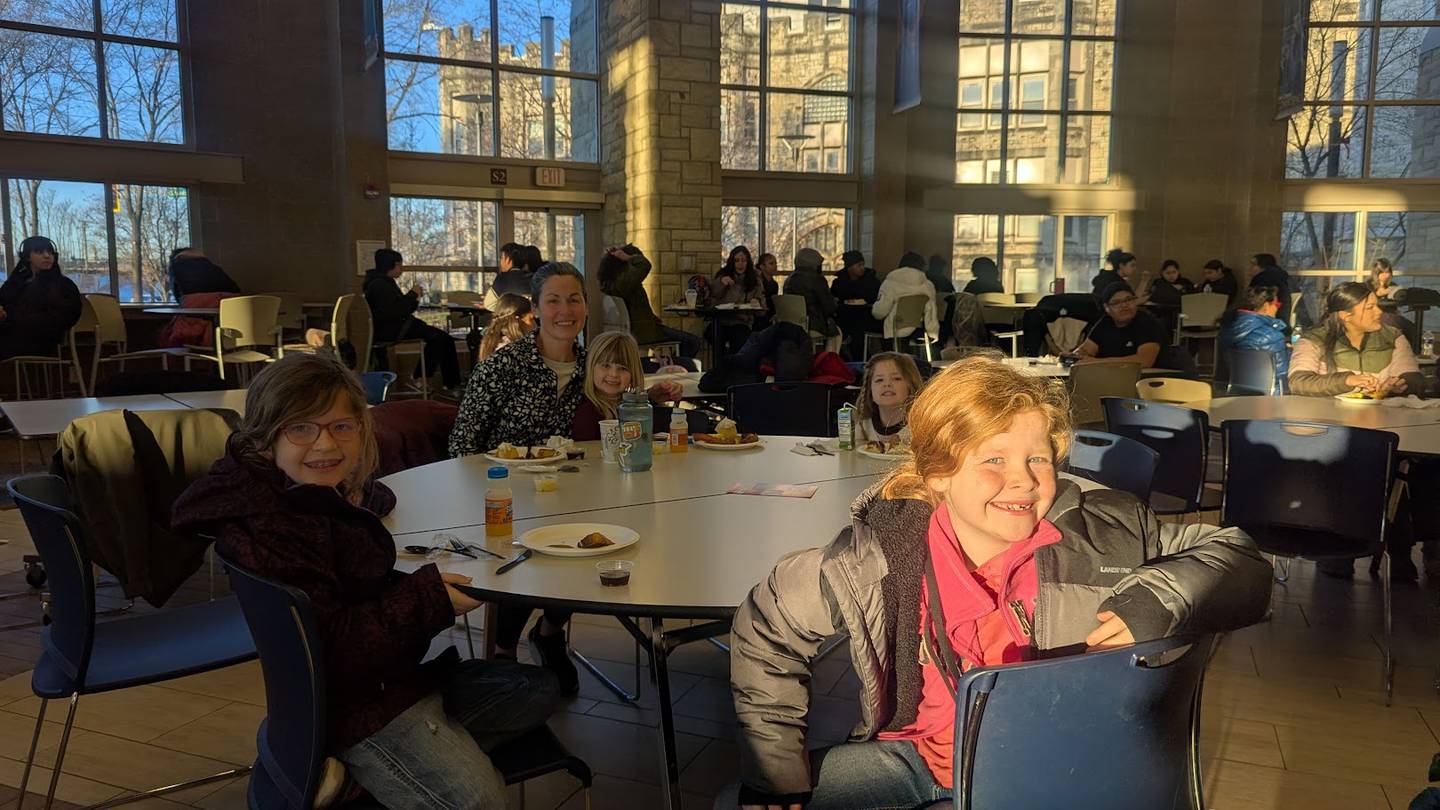Brigid Dowdle of Joliet participated in the 17th Annual MLK Day of Service on Monday, January 20, 2025, at Joliet Central High School with her daughters Collins, 3 (on lap) and (from left) Shea, 8, Charlie, 8 and Blake, 6.