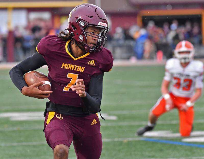 Montini quarterback Israel Abrams scrambles for big yardage to set up the Broncos second touchdown during a Class 3A second-round game on November 9, 2024 at Montini Catholic High School in Lombard.