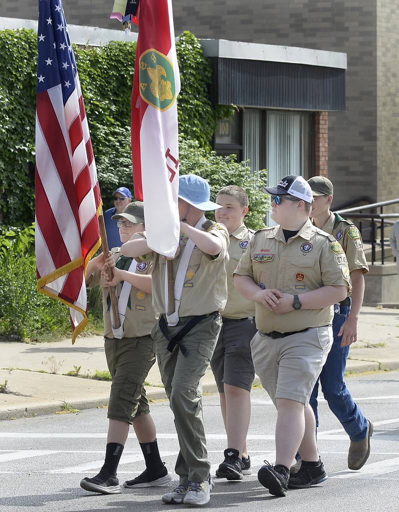 Local Boy Scout troops march along Main and Columbus streets Monday, May 29, 2023, during the Memorial Day parade in Ottawa.